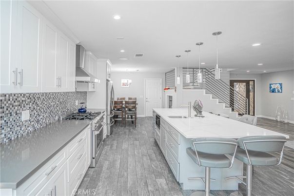 Dining room, Interior, Kitchen, Pendant Lights, Recessed Lighting, Stainless Steel Appliances, Wood Texture Flooring