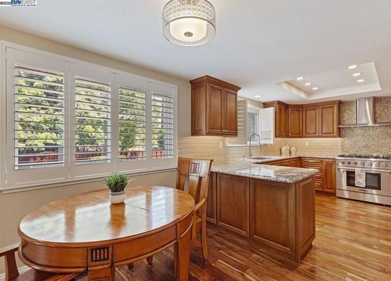 Dining room, Interior, Kitchen, Recessed Lighting, Stainless Steel Appliances, Wood Texture Flooring