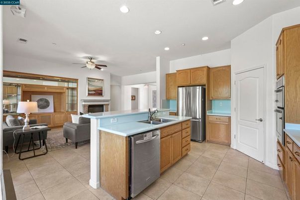 Fireplace, Interior, Kitchen, Living room, Recessed Lighting, Stainless Steel Appliances