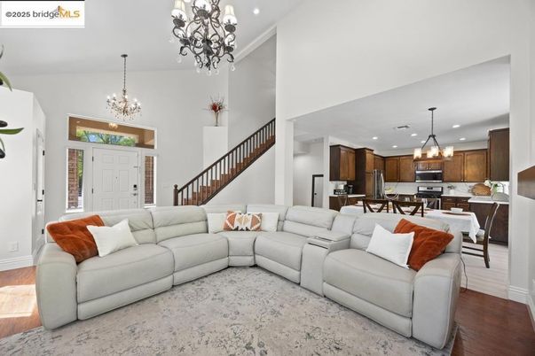 Chandelier, Dining room, Interior, Kitchen, Living room, Pendant Lights, Recessed Lighting, Stainless Steel Appliances, Wood Texture Flooring