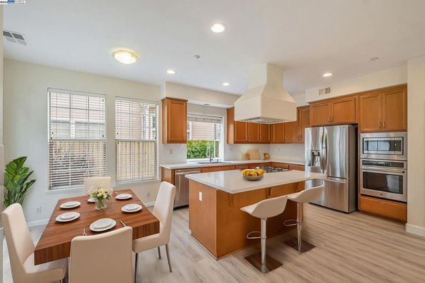 Dining room, Interior, Kitchen, Recessed Lighting, Stainless Steel Appliances, Wood Texture Flooring