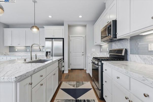 Interior, Kitchen, Pendant Lights, Recessed Lighting, Stainless Steel Appliances, Wood Texture Flooring