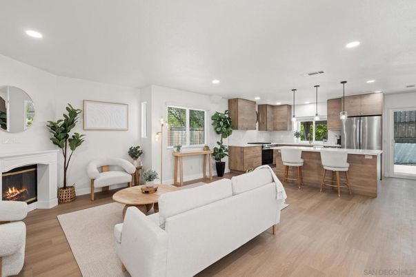 Fireplace, Interior, Kitchen, Living room, Pendant Lights, Recessed Lighting, Stainless Steel Appliances, Wood Texture Flooring
