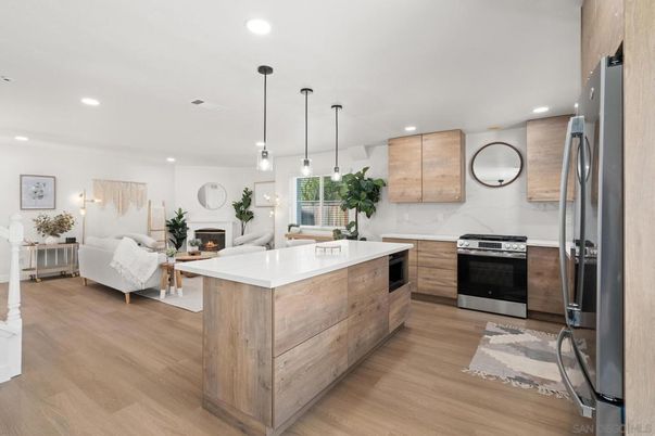 Fireplace, Interior, Kitchen, Living room, Pendant Lights, Recessed Lighting, Stainless Steel Appliances, Wood Texture Flooring