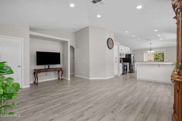 Empty room, Interior, Kitchen, Pendant Lights, Recessed Lighting, Stainless Steel Appliances, Wood Texture Flooring