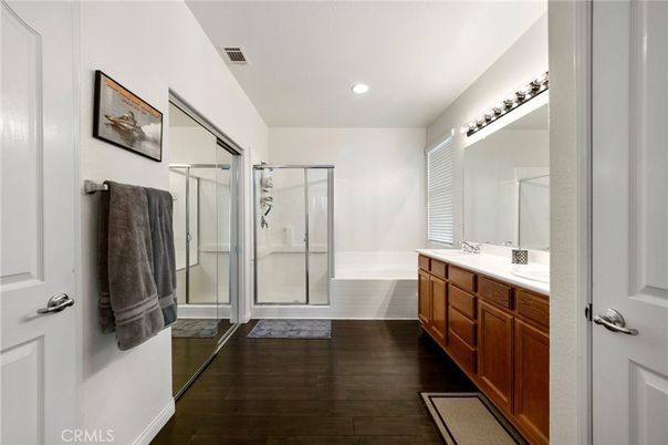 Bathroom, Dual Sink Vanities, Glass Shower, Interior, Recessed Lighting, Wood Texture Flooring