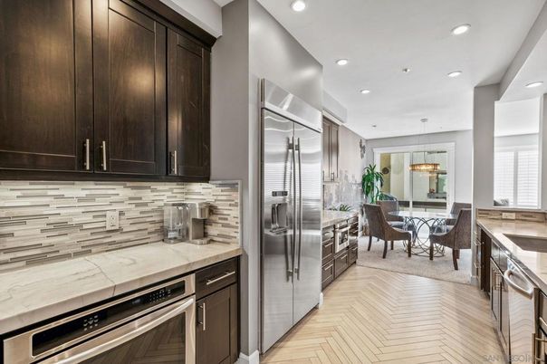 Chandelier, Dining room, Interior, Kitchen, Pendant Lights, Recessed Lighting, Stainless Steel Appliances, Wood Texture Flooring