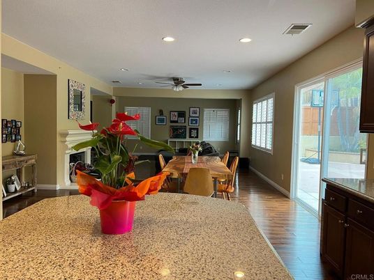 Dining room, Fireplace, Interior, Living room, Recessed Lighting, Wood Texture Flooring