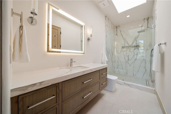 Bathroom, Dual Sink Vanities, Glass Shower, Interior, Marble Walls, Recessed Lighting