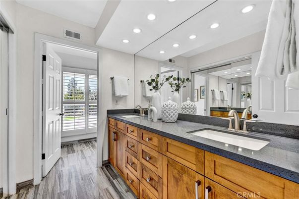 Bathroom, Dual Sink Vanities, Interior, Recessed Lighting, Wood Texture Flooring