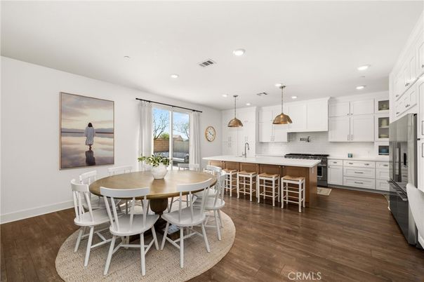 Dining room, Interior, Kitchen, Pendant Lights, Recessed Lighting, Stainless Steel Appliances, Wood Texture Flooring