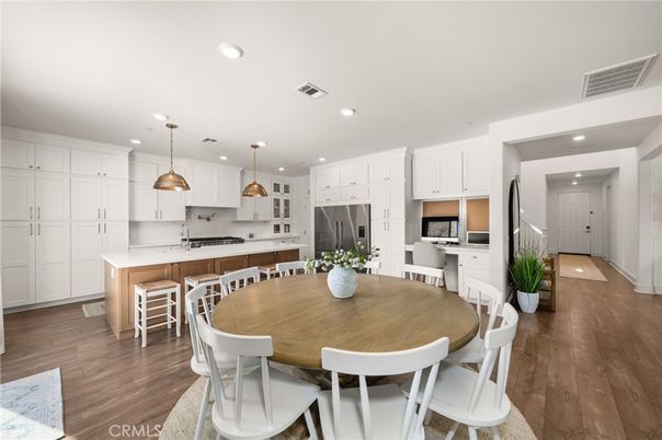Dining room, Interior, Kitchen, Pendant Lights, Recessed Lighting, Stainless Steel Appliances, Wood Texture Flooring