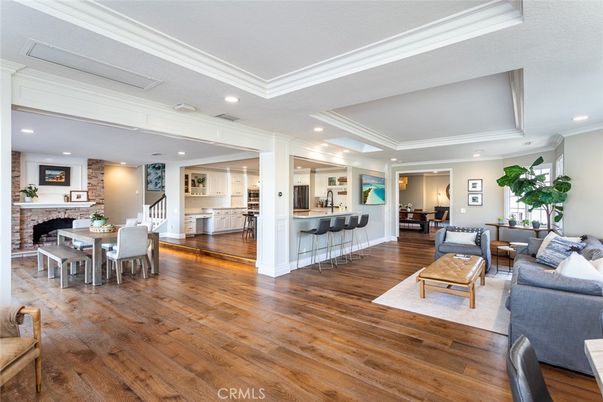 Dining room, Fireplace, Interior, Kitchen, Living room, Recessed Lighting, Stone Walls, Wood Texture Flooring