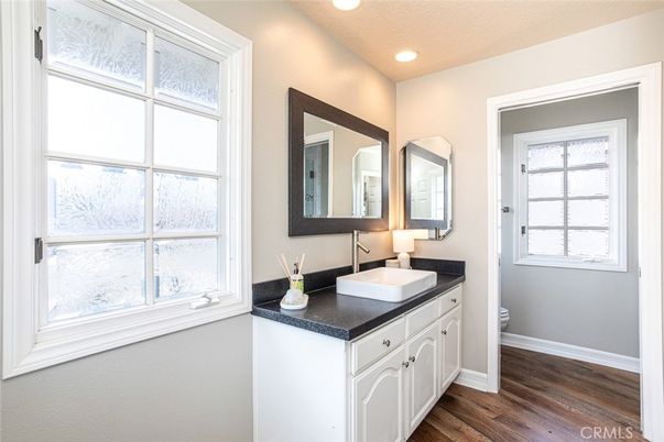Bathroom, Dual Sink Vanities, Interior, Recessed Lighting, Wood Texture Flooring