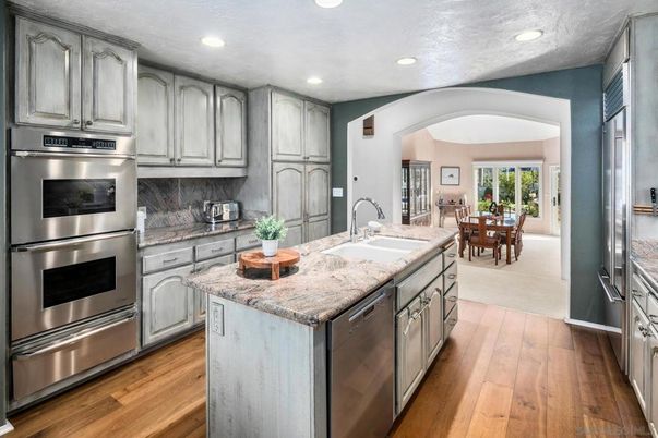 Dining room, Interior, Kitchen, Recessed Lighting, Stainless Steel Appliances, Wood Texture Flooring