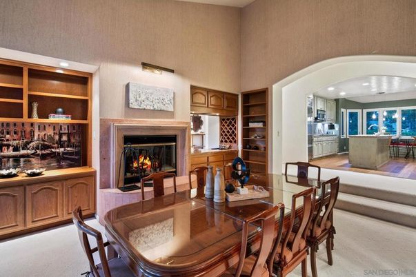 Dining room, Fireplace, Interior, Kitchen, Recessed Lighting, Stainless Steel Appliances, Wood Texture Flooring