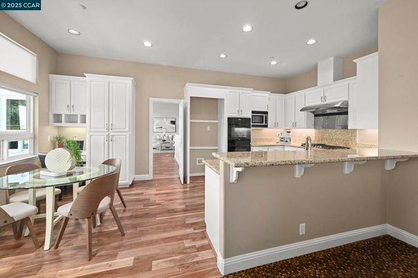 Dining room, Interior, Kitchen, Recessed Lighting, Stainless Steel Appliances, Wood Texture Flooring