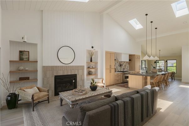 Dining room, Fireplace, Interior, Kitchen, Living room, Pendant Lights, Stainless Steel Appliances, Wood Texture Flooring
