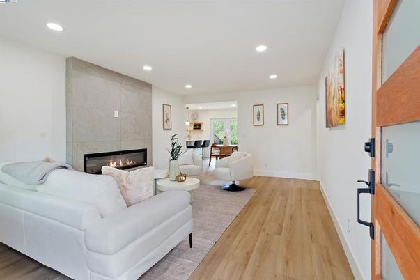 Dining room, Fireplace, Interior, Living room, Recessed Lighting, Wood Texture Flooring