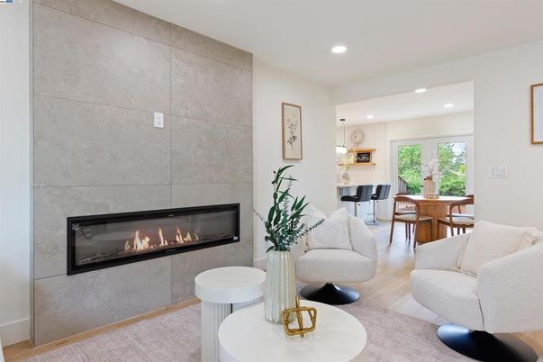 Dining room, Fireplace, Interior, Living room, Pendant Lights, Recessed Lighting, Wood Texture Flooring