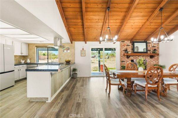 Chandelier, Dining room, Fireplace, Interior, Kitchen, Pendant Lights, Stone Walls, Wooden Beams, Wooden Ceilings, Wood Texture Flooring