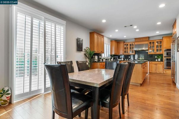 Dining room, Interior, Kitchen, Recessed Lighting, Stainless Steel Appliances, Wood Texture Flooring