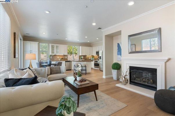 Dining room, Fireplace, Interior, Kitchen, Living room, Recessed Lighting, Stainless Steel Appliances, Wood Texture Flooring