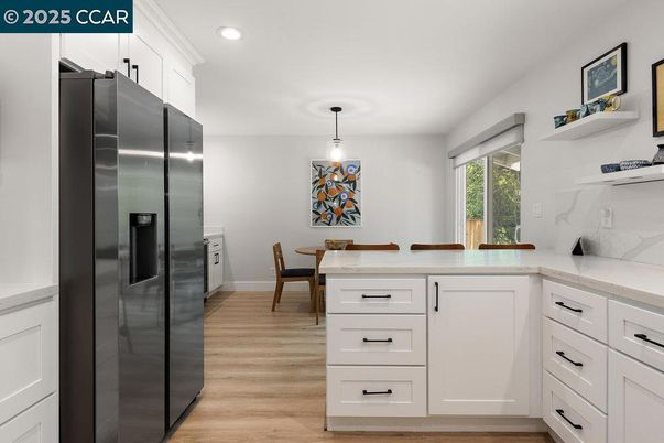 Dining room, Interior, Kitchen, Pendant Lights, Recessed Lighting, Stainless Steel Appliances, Wood Texture Flooring