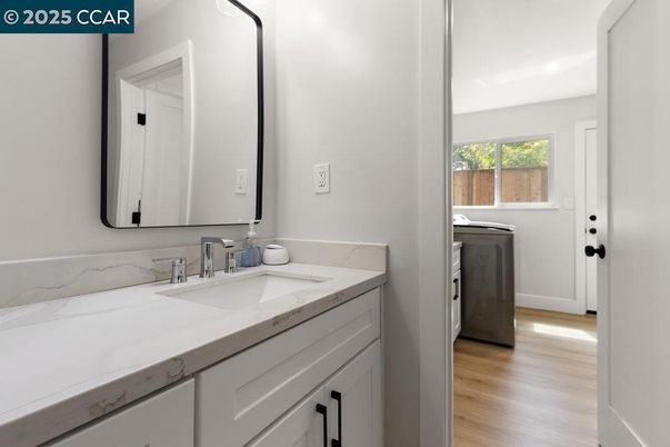 Bathroom, Dual Sink Vanities, Interior, Washer, Wood Texture Flooring