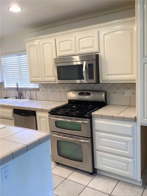 Interior, Kitchen, Recessed Lighting, Stainless Steel Appliances, Tile Countertops