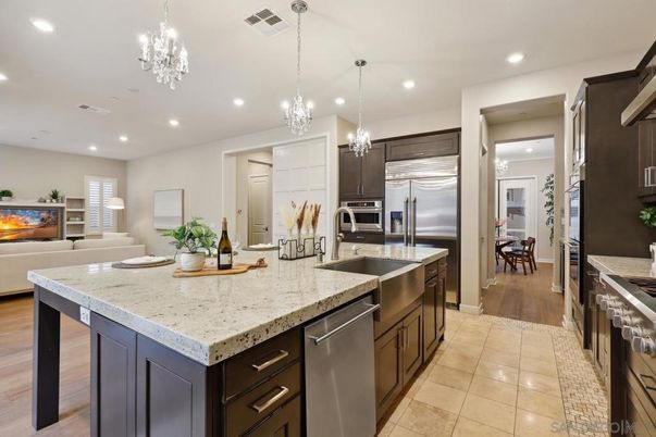 Chandelier, Interior, Kitchen, Living room, Pendant Lights, Recessed Lighting, Stainless Steel Appliances, Wood Texture Flooring