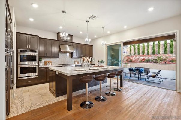 Dining room, Interior, Kitchen, Pendant Lights, Recessed Lighting, Stainless Steel Appliances, Wood Texture Flooring