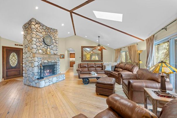 Fireplace, Interior, Living room, Recessed Lighting, Stone Walls, Wood Texture Flooring