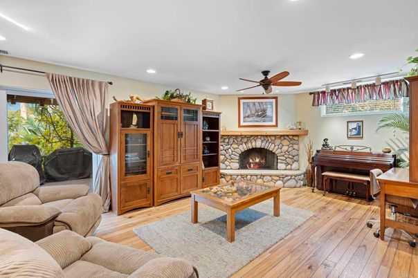 Fireplace, Interior, Living room, Piano, Recessed Lighting, Wood Texture Flooring