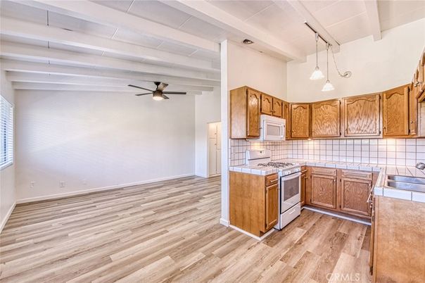 Interior, Kitchen, Pendant Lights, Tile Countertops, Wood Texture Flooring