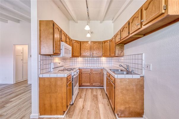 Interior, Kitchen, Pendant Lights, Tile Countertops, Wood Texture Flooring