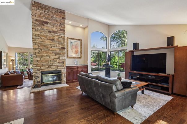 Fireplace, Interior, Living room, Recessed Lighting, Stone Walls, Wood Texture Flooring