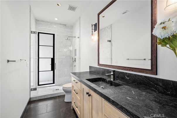 Bathroom, Dual Sink Vanities, Glass Shower, Interior, Marble Walls, Recessed Lighting