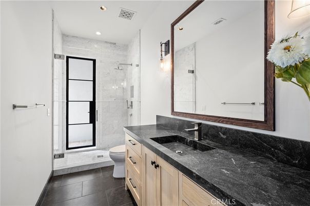Bathroom, Dual Sink Vanities, Glass Shower, Interior, Marble Walls, Recessed Lighting