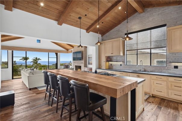 Fireplace, Interior, Kitchen, Living room, Pendant Lights, Recessed Lighting, Stainless Steel Appliances, Water, Wooden Beams, Wooden Ceilings, Wood Texture Flooring