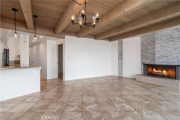 Empty room, Fireplace, Interior, Pendant Lights, Stone Walls, Wooden Beams, Wooden Ceilings