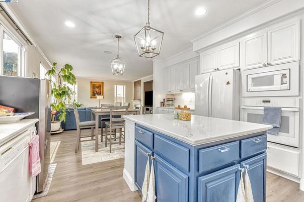 Dining room, Interior, Kitchen, Living room, Pendant Lights, Recessed Lighting, Stainless Steel Appliances, Wood Texture Flooring