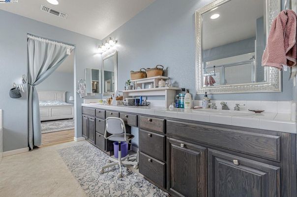 Bathroom, Dual Sink Vanities, Interior, Recessed Lighting, Tile Countertops, Wood Texture Flooring