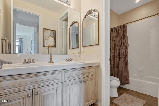 Bathroom, Dual Sink Vanities, Interior, Recessed Lighting, Tile Countertops, Wood Texture Flooring
