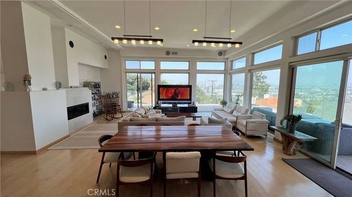 Dining room, Fireplace, Interior, Living room, Pendant Lights, Recessed Lighting, Wood Texture Flooring