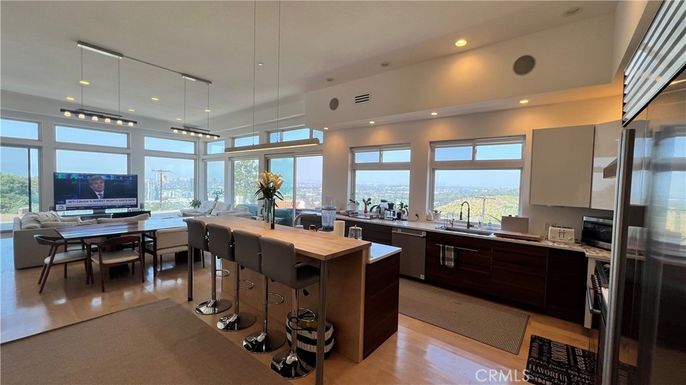 Dining room, Interior, Kitchen, Living room, Pendant Lights, Recessed Lighting, Stainless Steel Appliances, Water, Wood Texture Flooring
