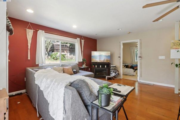 Bedroom, Fireplace, Interior, Living room, Recessed Lighting, Wood Texture Flooring