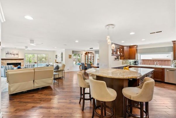 Dining room, Fireplace, Interior, Kitchen, Living room, Pendant Lights, Recessed Lighting, Stainless Steel Appliances, Wood Texture Flooring