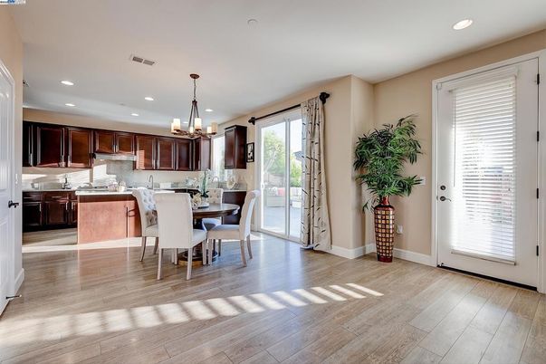 Chandelier, Dining room, Interior, Kitchen, Pendant Lights, Recessed Lighting, Stainless Steel Appliances, Wood Texture Flooring