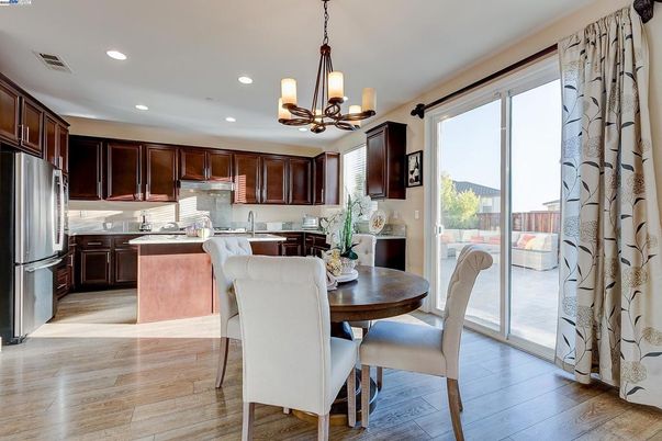 Dining room, Interior, Kitchen, Pendant Lights, Recessed Lighting, Stainless Steel Appliances, Wood Texture Flooring